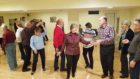 Photo of people square dancing.